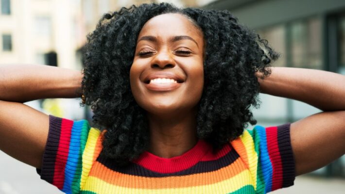 curly-haired-woman-smiling