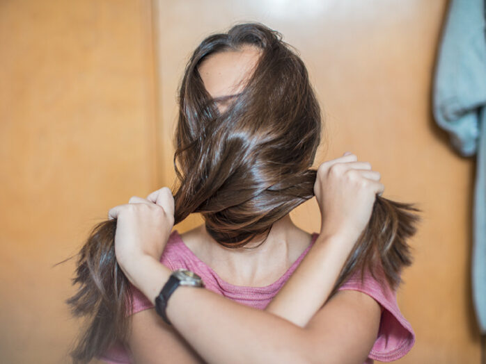 girl-covering-her-face-with-her-hair-732x549-thumbnail-698x524-1